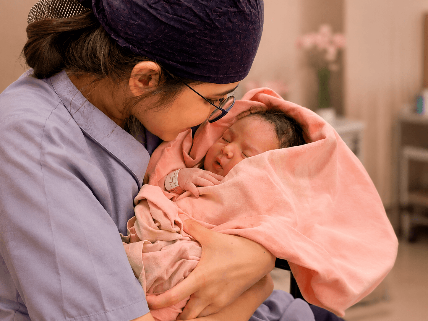 Dr. Shweta Nadkarni holding a newborn baby